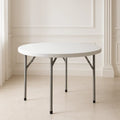 Table pliante ronde en plastique blanc avec pieds en acier gris